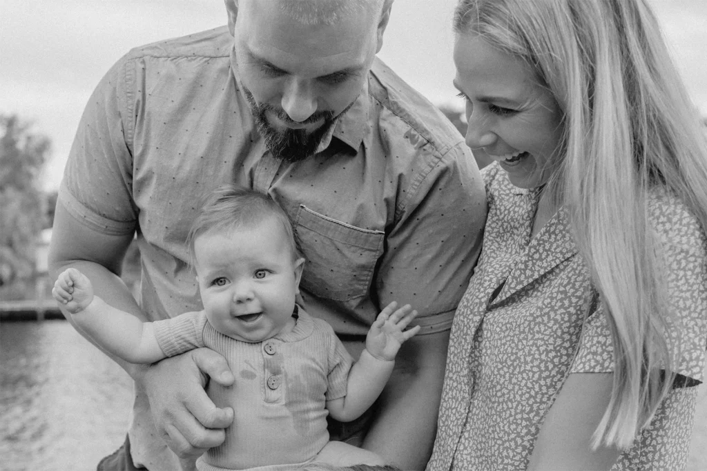 Dad carrying baby boy during an At-Home Family Session in Fort Lauderdale