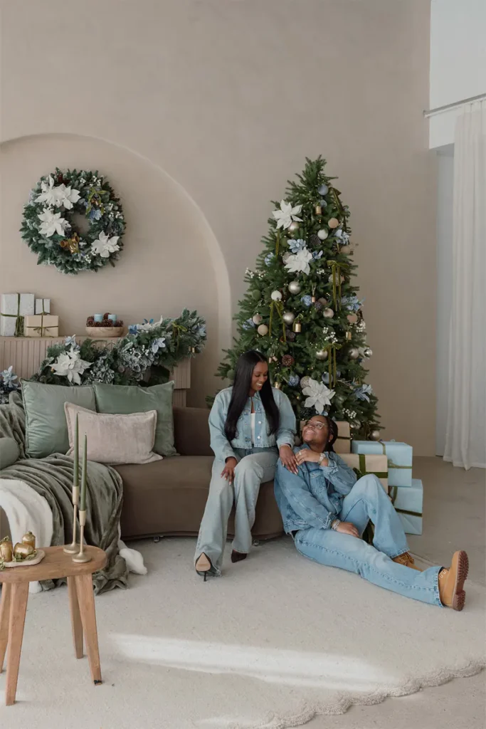 Inclusive couple sitting down and facing each other in a modern studio setting at Mint Room Miami