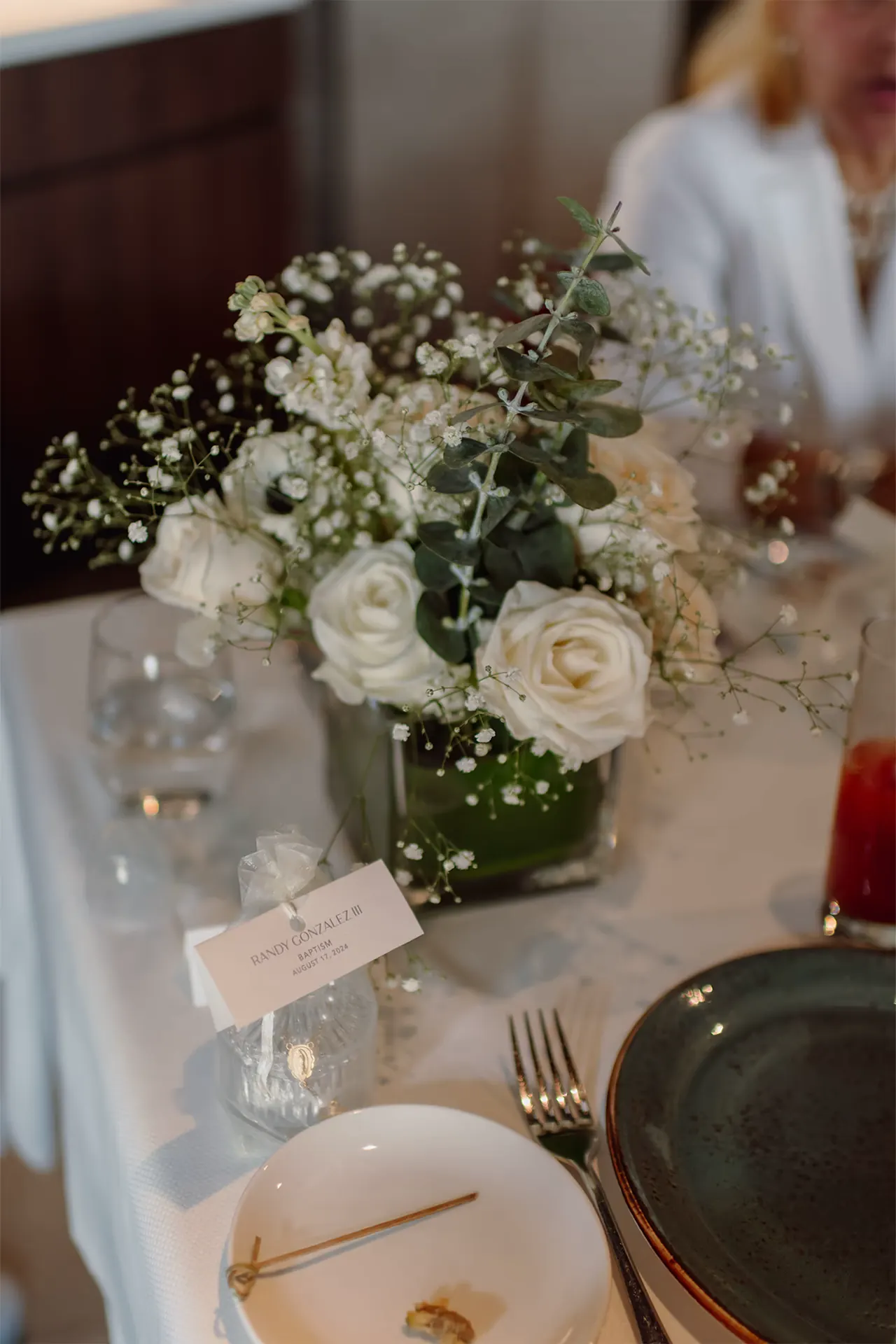 Elegant flower arrangements for a baptism celebration at Zucca in Coral Gables