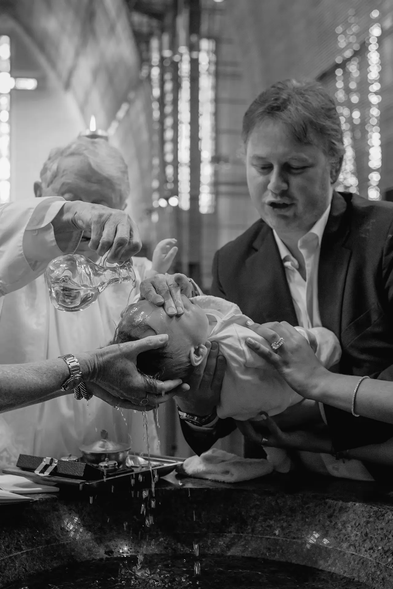 Artistic black and white photography of a baptism ceremony in South Florida