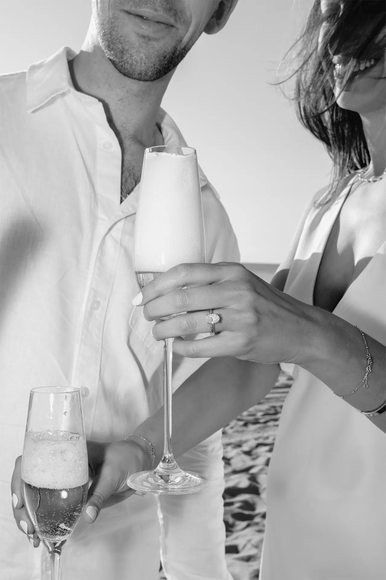 Artistic flash photography close-up of champagne glasses, perfect for save the dates