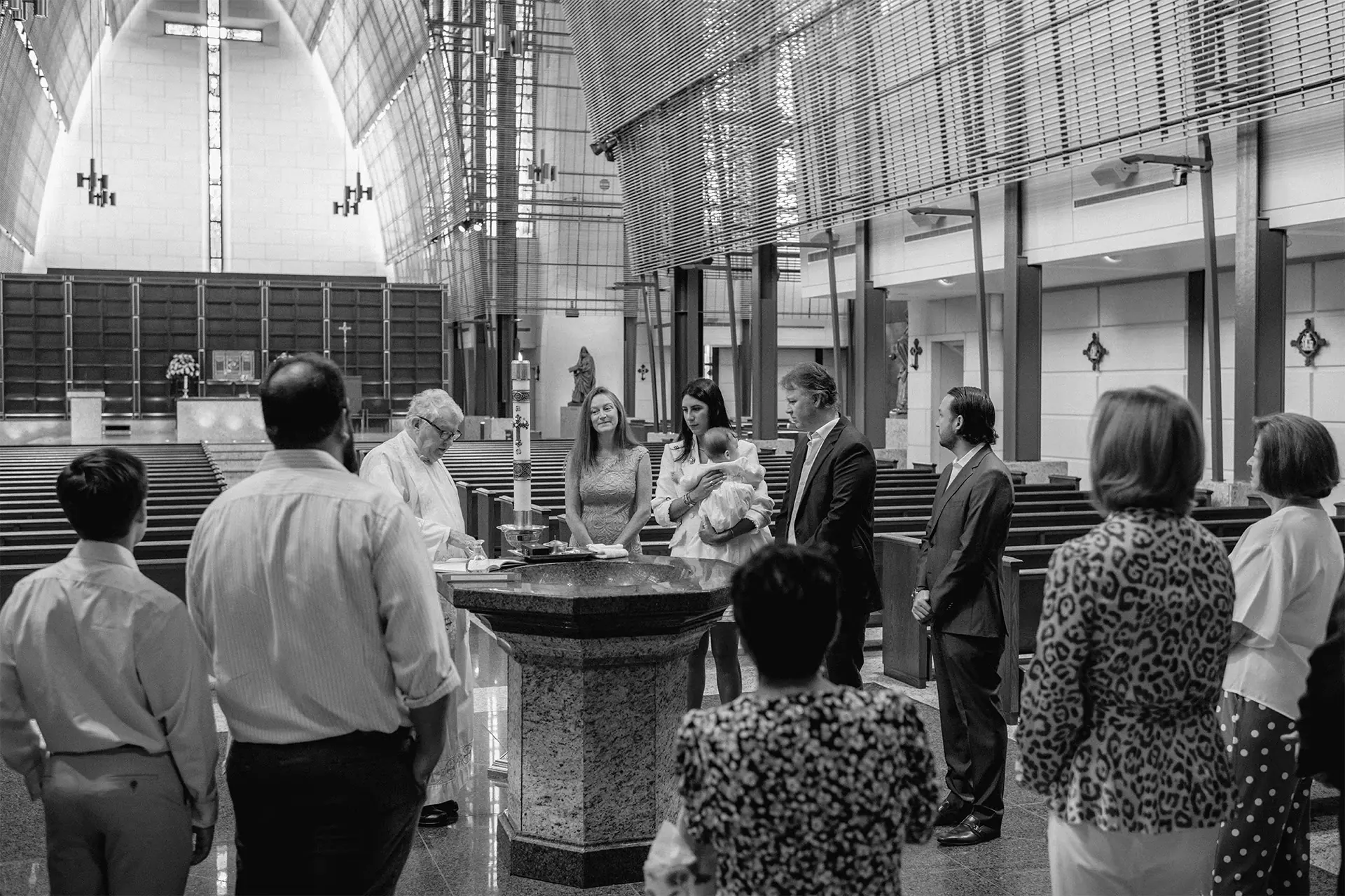 Black and white documentary style photography of a sacred baptism ceremony