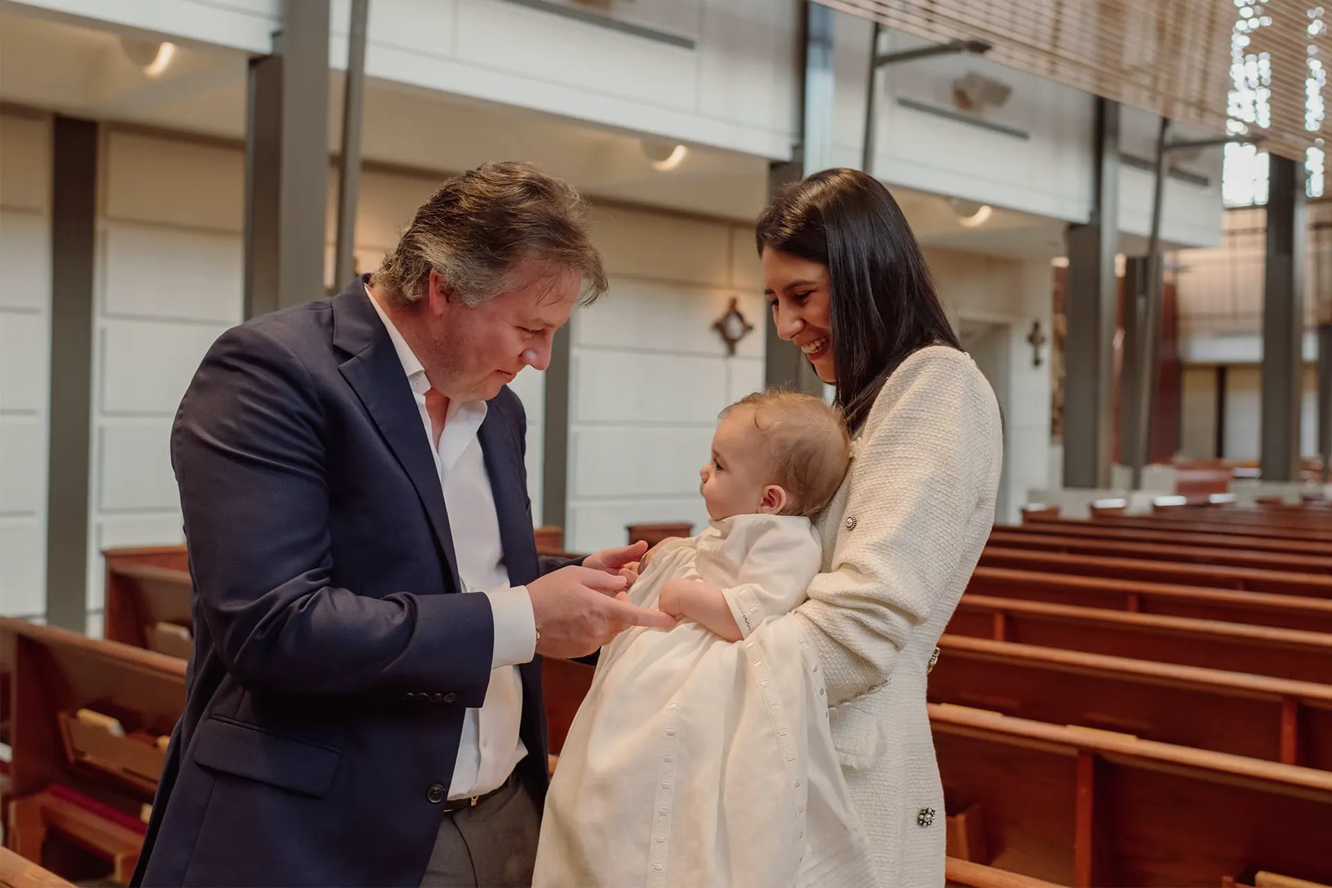 Candid family moments during the baptism reception in Miami
