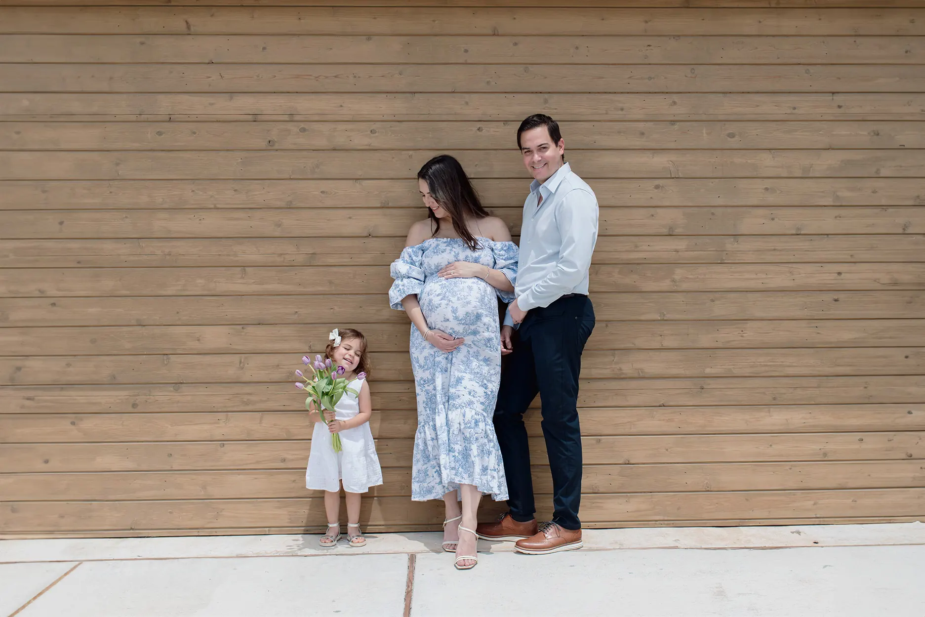 Family portrait outside their home in Austin during a maternity session.