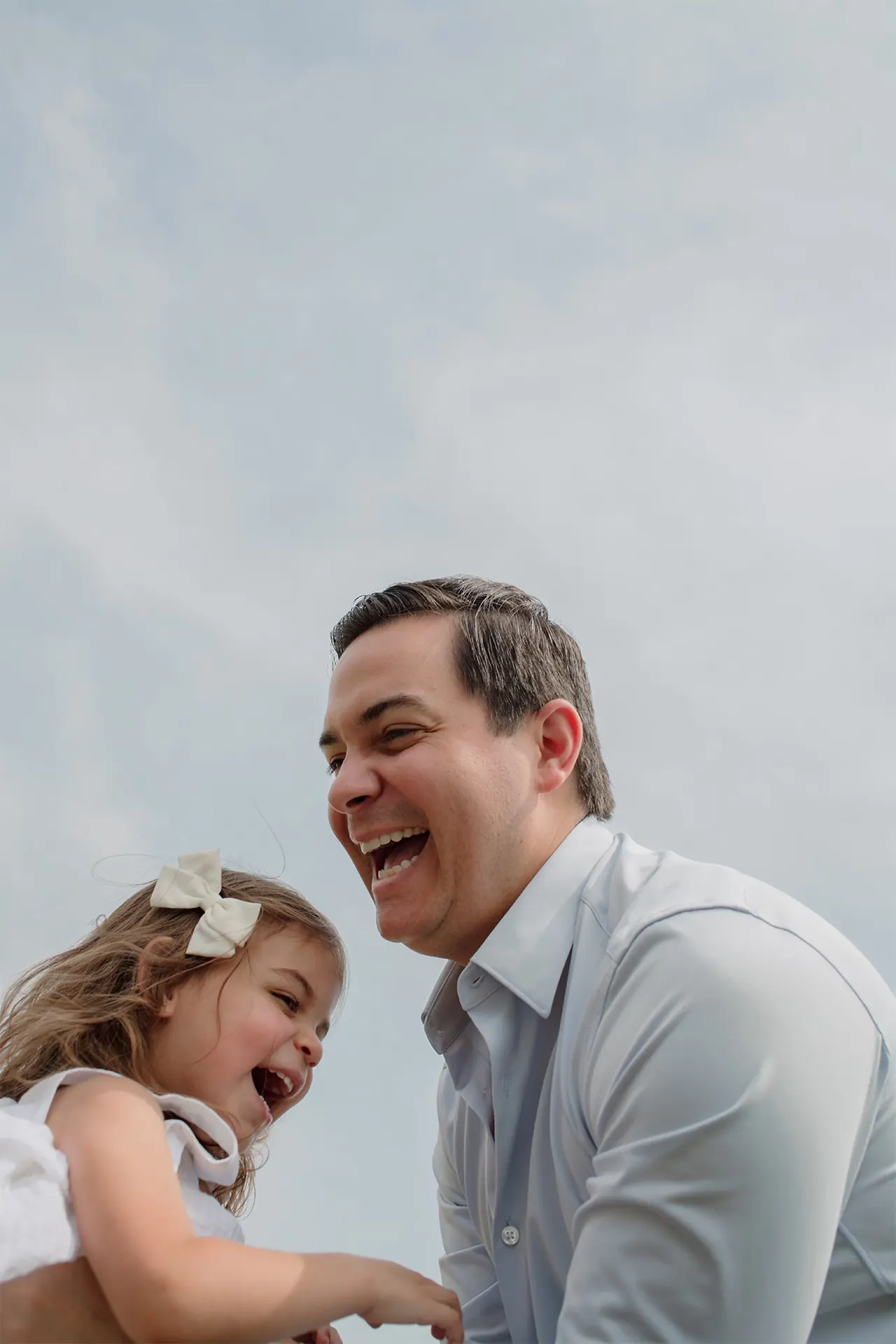 Father and daughter candid portrait during an at-home session.