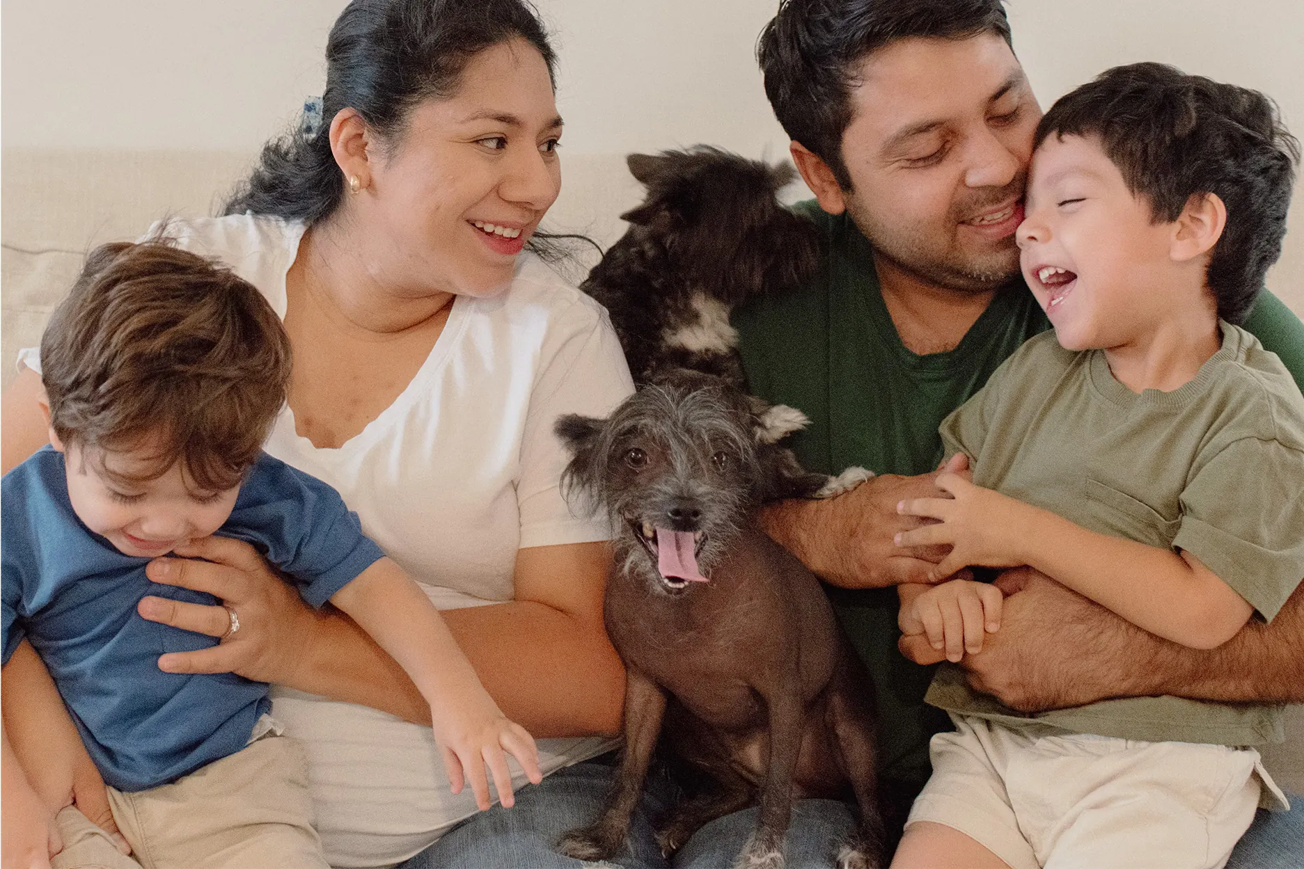 Closeup horizontal family portrait with their pet dogs in Monterrey