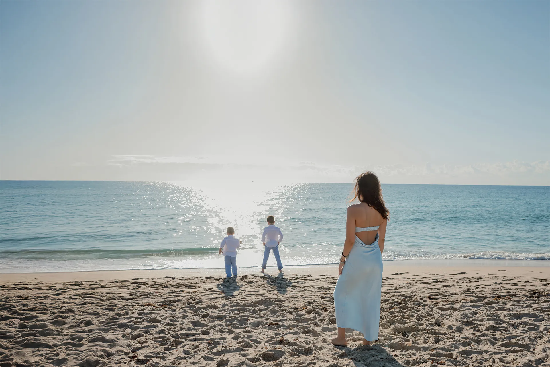 Authentic moment of a mother looking at her sons during a sunrise photography session.