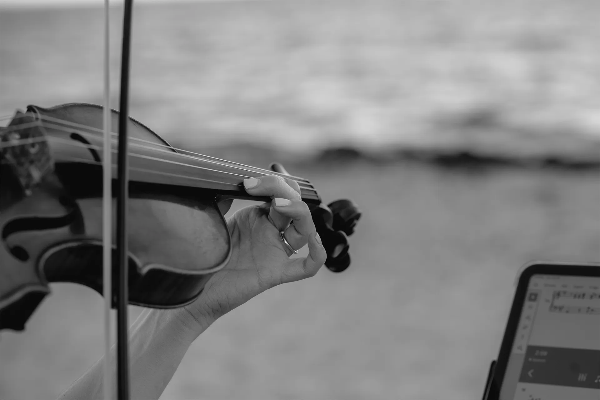 Closeup of a violinist playing during a romantic beach proposal in Delray Beach