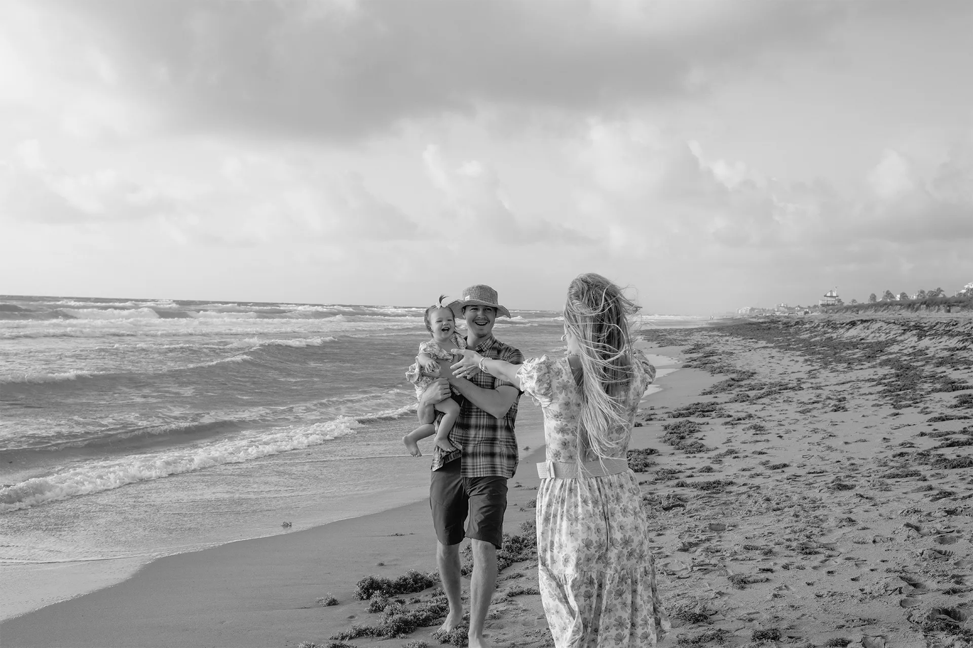 Mother running towards her daughter during a playful and authentic family session.