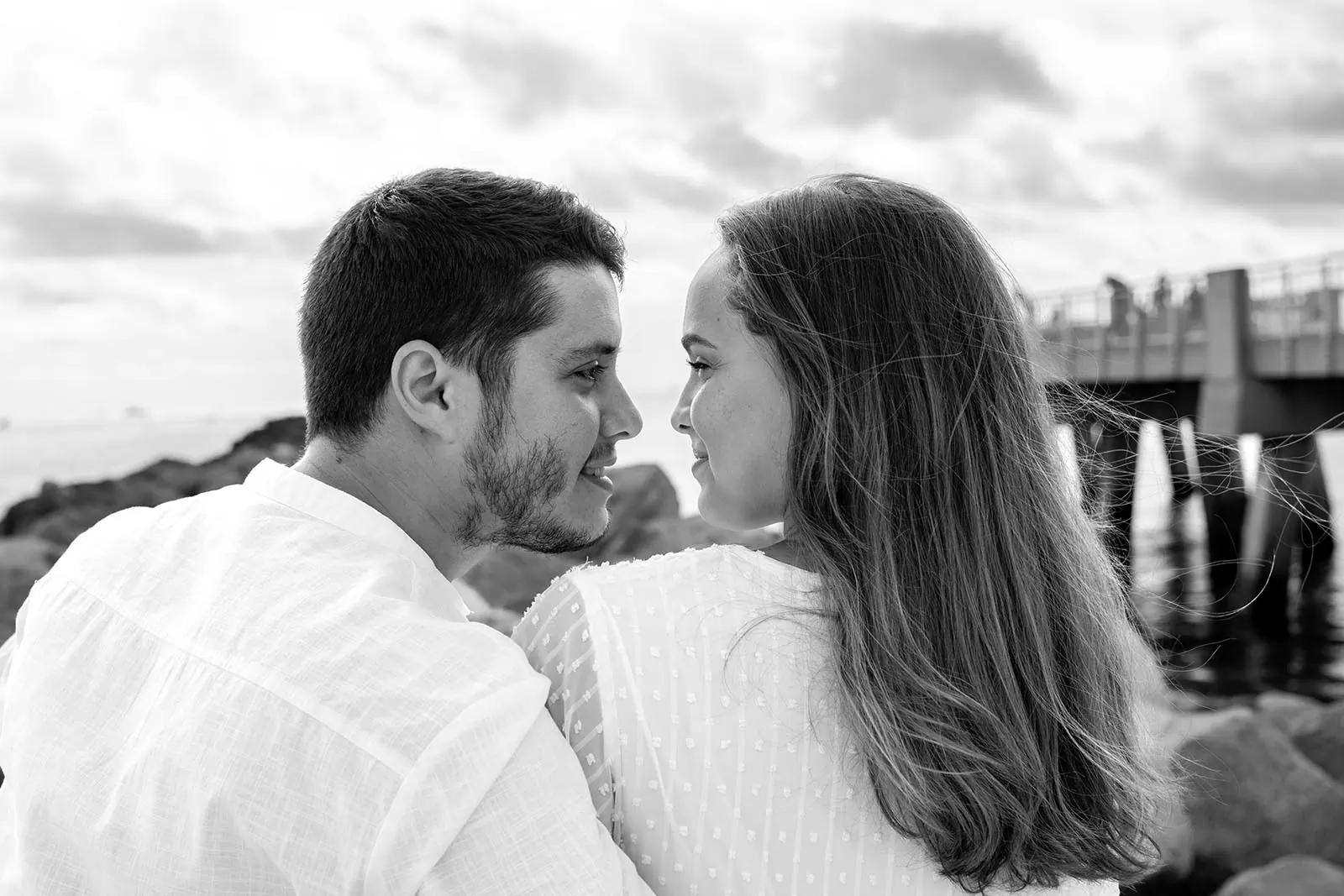 Engaged couple sharing a romantic moment in Miami Beach during a photography session
