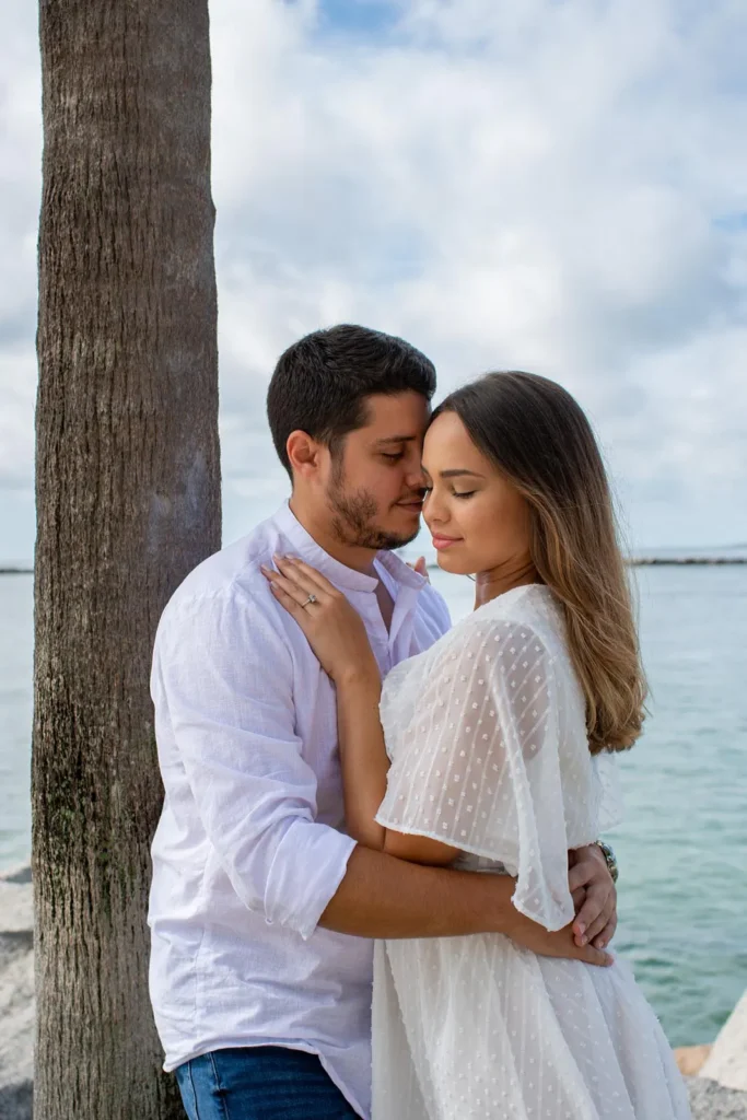 Romantic portrait of a couple during an engagement session at South Pointe Park
