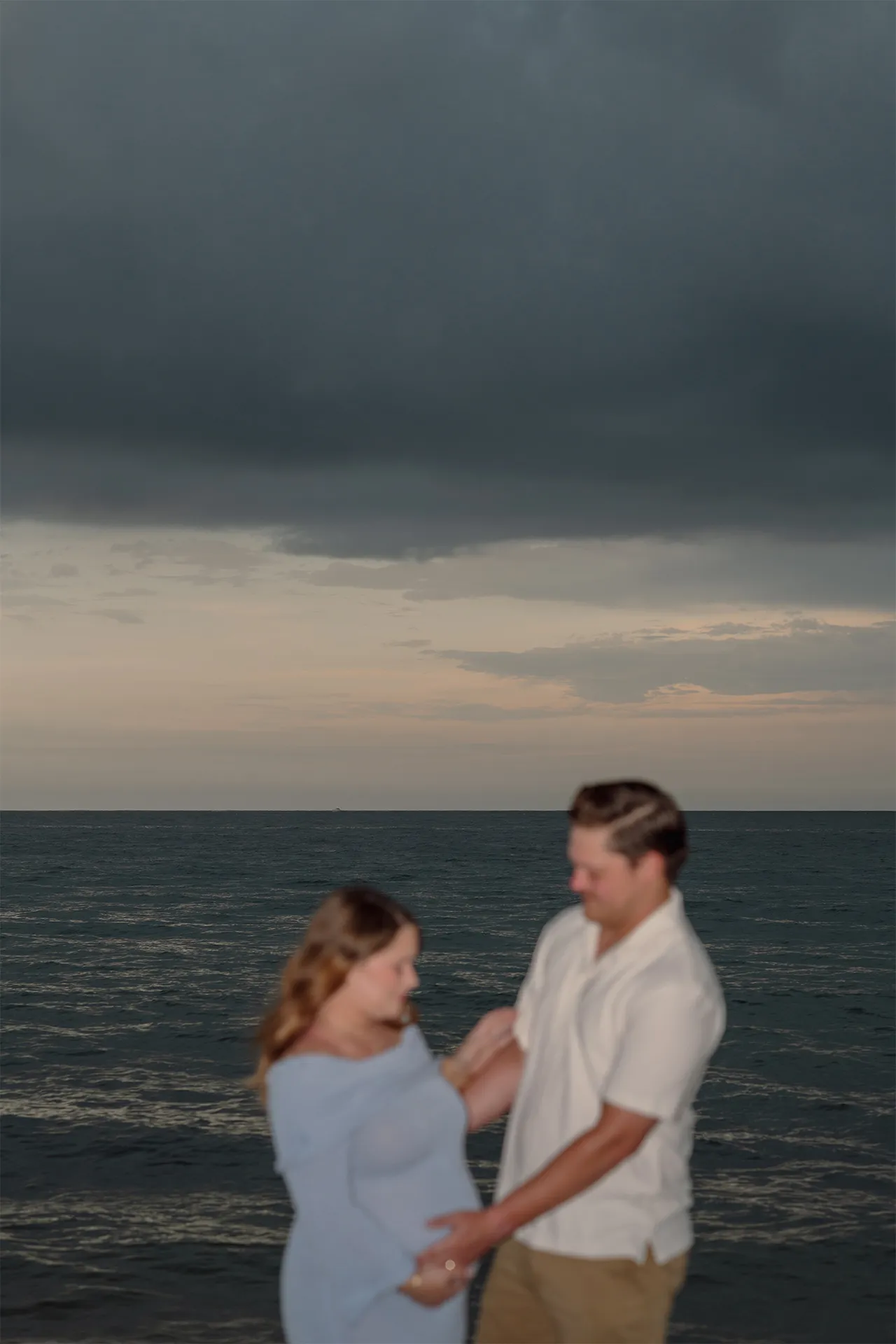 Romantic and blurry artistic portrait of an expecting couple in Fort Lauderdale