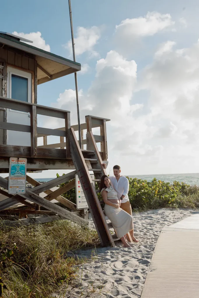 Maternity session by the lifeguard tower at South Inlet Park in Boca Raton
